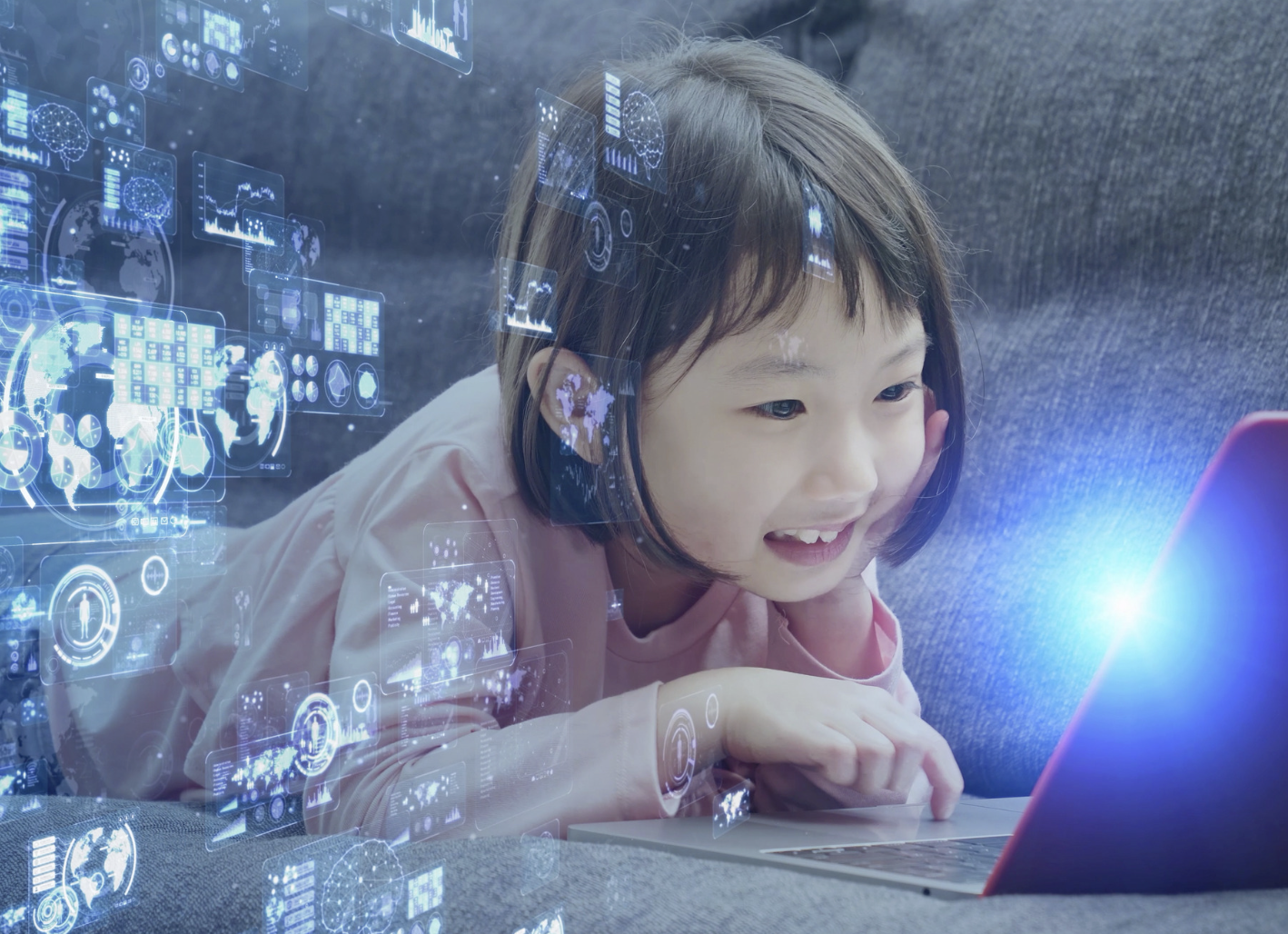 little girl on laptop with edtech symbols all around her